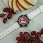 Rosso chronograph with white band tabletop image.